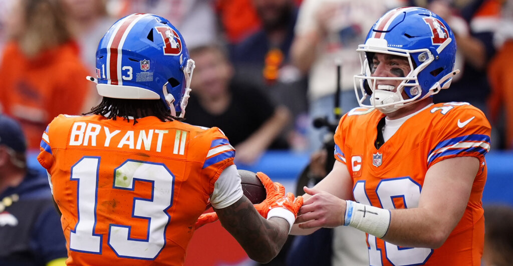 Oct 26, 2025; Denver, Colorado, USA; Denver Broncos wide receiver Pat Bryant (13) celebrates scoring a touchdown with quarterback Bo Nix (10) in the second quarter against the Dallas Cowboys at Empower Field at Mile High. Mandatory Credit: Ron Chenoy-Imagn Images