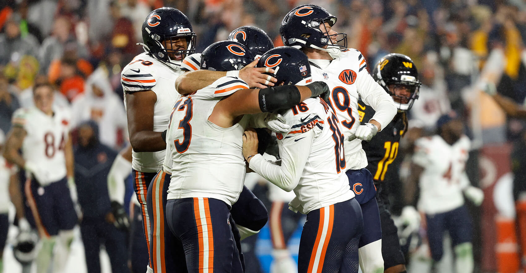 Oct 13, 2025; Landover, Maryland, USA; Chicago Bears kicker Jake Moody (16) celebrates with teammates after kicking a game-winning field goal against the Washington Commanders during the fourth quarter at Northwest Stadium. Mandatory Credit: Geoff Burke-Imagn Images