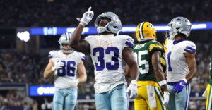 Sep 28, 2025; Arlington, Texas, USA; Dallas Cowboys running back Javonte Williams (33) celebrates after scoring a touchdown against the Green Bay Packers in the fourth quarter at AT&T Stadium. Mandatory Credit: Kevin Jairaj-Imagn Images