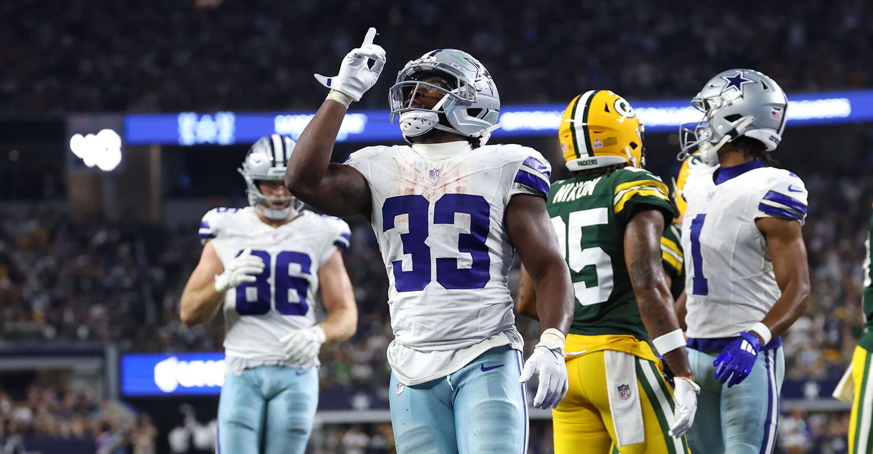 Sep 28, 2025; Arlington, Texas, USA; Dallas Cowboys running back Javonte Williams (33) celebrates after scoring a touchdown against the Green Bay Packers in the fourth quarter at AT&T Stadium. Mandatory Credit: Kevin Jairaj-Imagn Images