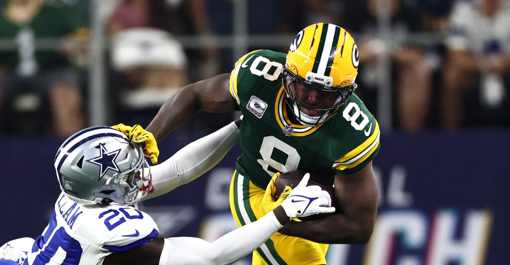 Sep 28, 2025; Arlington, Texas, USA; Green Bay Packers running back Josh Jacobs (8) runs against Dallas Cowboys cornerback Kaiir Elam (20) in the first quarter at AT&T Stadium. Mandatory Credit: Kevin Jairaj-Imagn Images