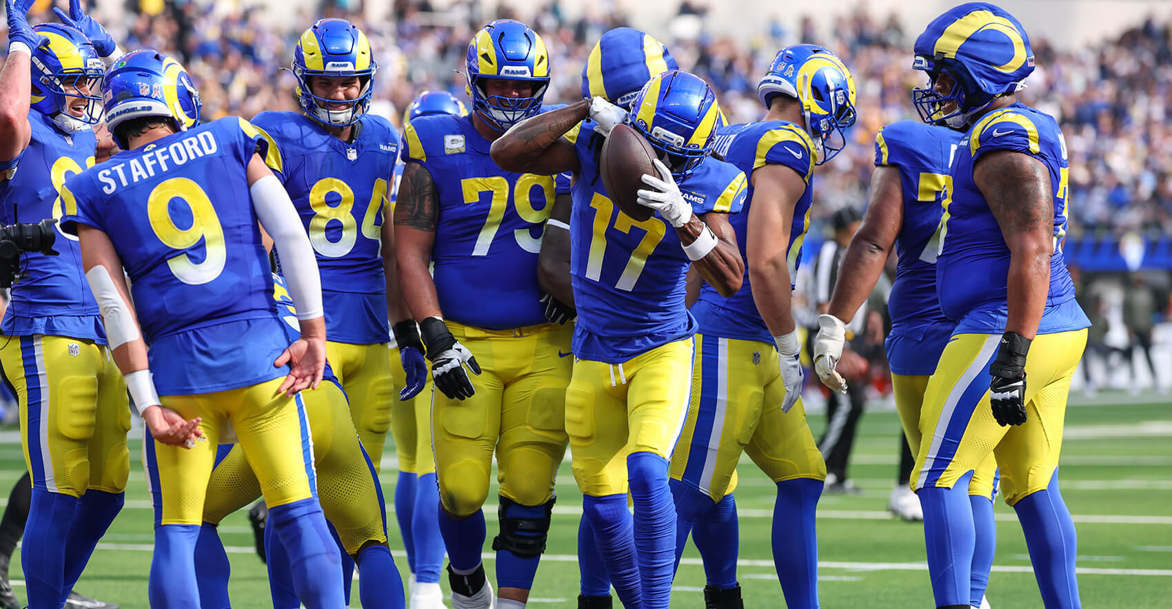 Nov 2, 2025; Inglewood, California, USA; Los Angeles Rams wide receiver Davante Adams (17) reacts with quarterback Matthew Stafford (9) and teammates after catching a touchdown against the New Orleans Saints during the first half at SoFi Stadium. Mandatory Credit: Kiyoshi Mio-Imagn Images