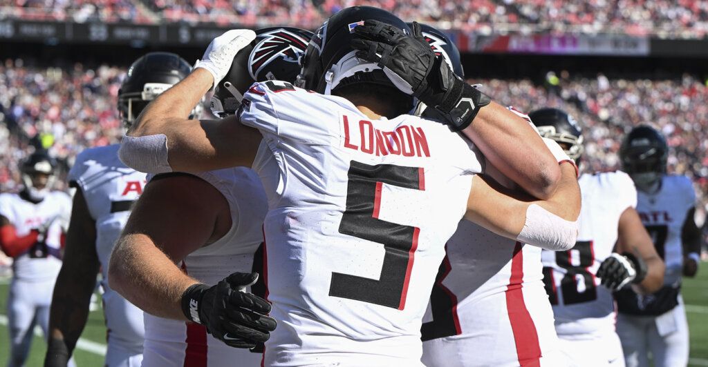 Nov 2, 2025; Foxborough, Massachusetts, USA; Atlanta Falcons wide receiver Drake London (5) celebrates his touchdown catch against the New England Patriots with teammates during the first quarter at Gillette Stadium. Mandatory Credit: Brian Fluharty-Imagn Images