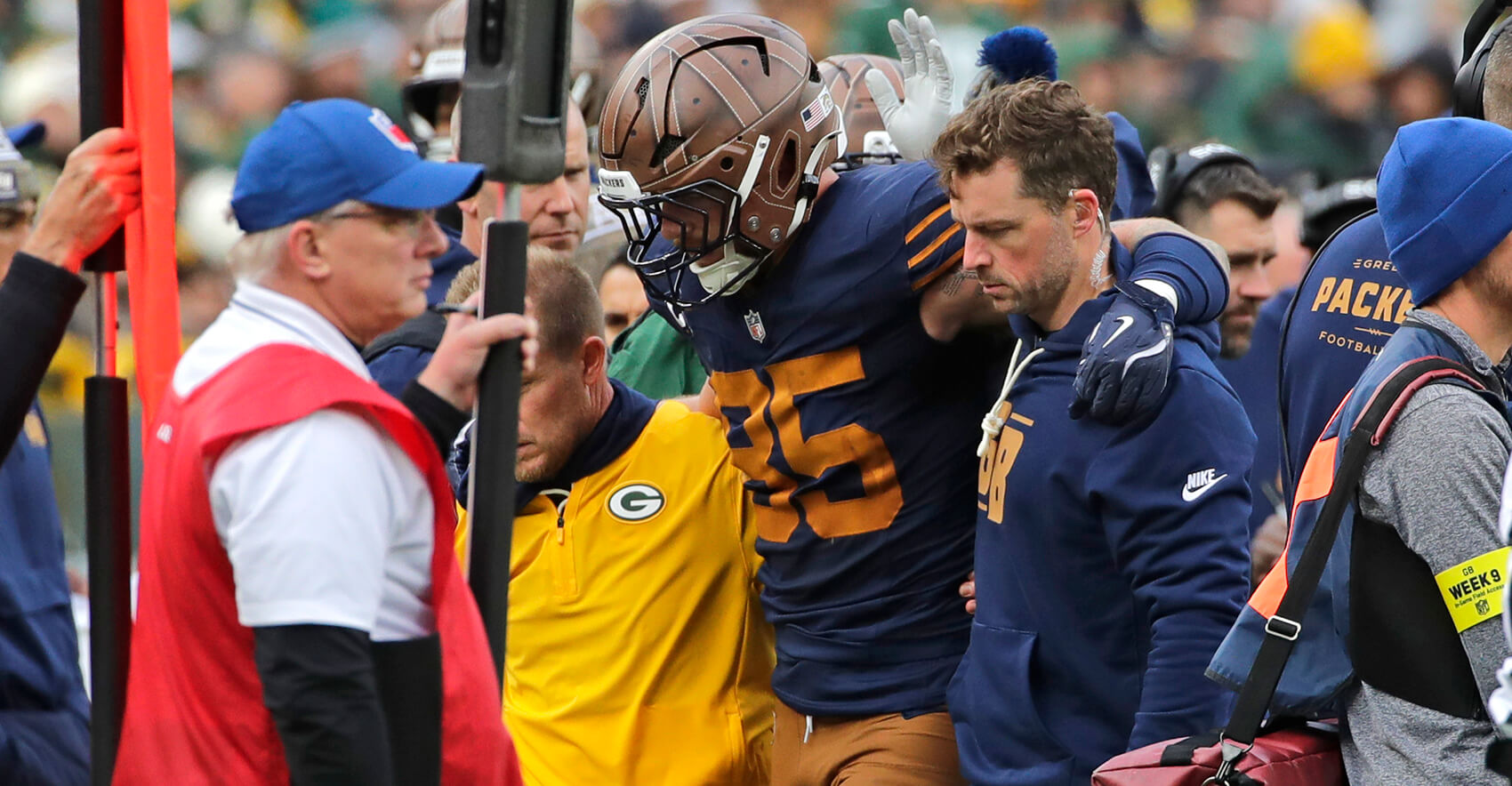 Nov 2, 2025; Green Bay, Wisconsin, USA; Green Bay Packers tight end Tucker Kraft (85) is assisted off the field after getting injured against the Carolina Panthers during their football game at Lambeau Field. Mandatory Credit: Dan Powers-USA TODAY Network via Imagn Images