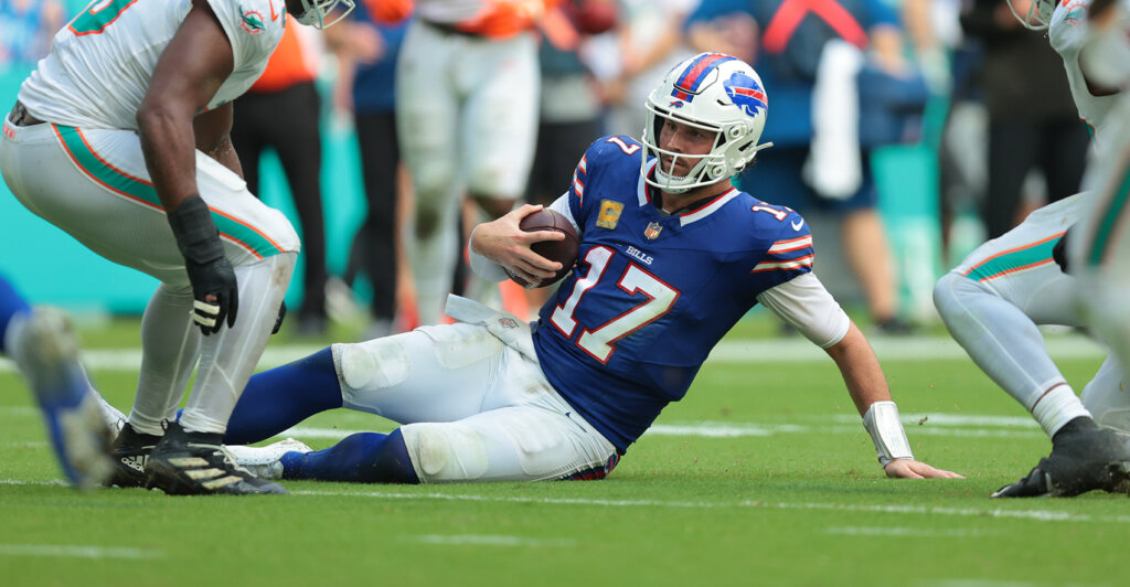 Nov 9, 2025; Miami Gardens, Florida, USA; Buffalo Bills quarterback Josh Allen (17) slides against the Miami Dolphins during the second half at Hard Rock Stadium. Mandatory Credit: Sam Navarro-Imagn Images