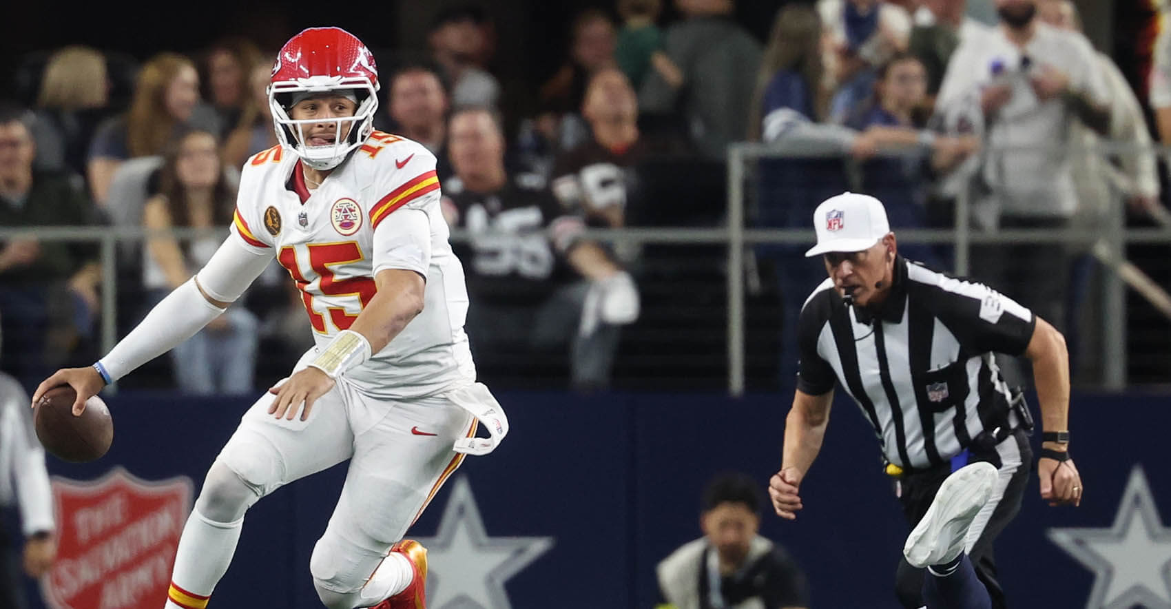 Nov 27, 2025; Arlington, Texas, USA; Kansas City Chiefs quarterback Patrick Mahomes (15) escapes the pressure from Dallas Cowboys defensive end Donovan Ezeiruaku (41) during the fourth quarter at AT&T Stadium. Mandatory Credit: Kevin Jairaj-Imagn Images