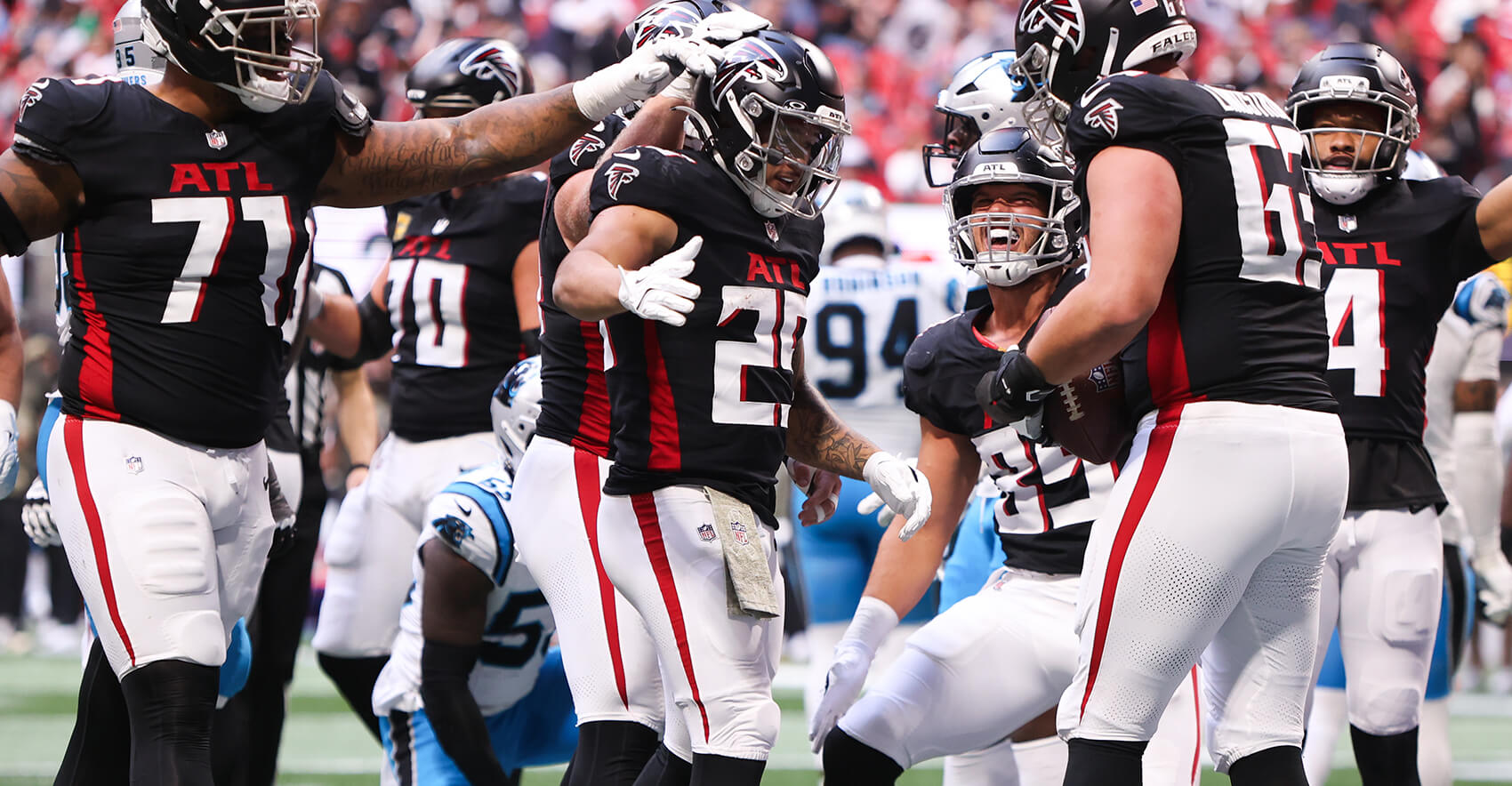 Nov 16, 2025; Atlanta, Georgia, USA; Atlanta Falcons running back Tyler Allgeier (25) celebrates a touchdown with tight end Teagan Quitoriano (85) and guard Chris Lindstrom (63) in the second quarter against the Carolina Panthers at Mercedes-Benz Stadium. Mandatory Credit: Brett Davis-Imagn Images