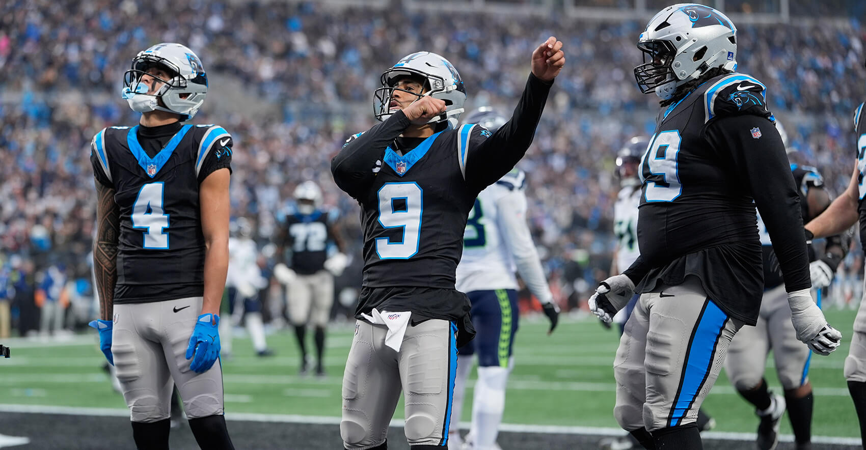 Dec 28, 2025; Charlotte, North Carolina, USA; Carolina Panthers quarterback Bryce Young (9) acknowledges the crowd after scoring a touchdown against the Seattle Seahawks during the third quarter at Bank of America Stadium. Mandatory Credit: Jim Dedmon-Imagn Images