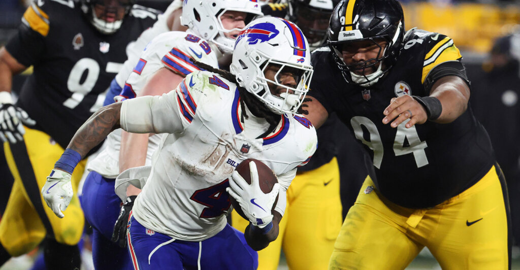 Nov 30, 2025; Pittsburgh, Pennsylvania, USA; Buffalo Bills running back James Cook III (4) rushes as Pittsburgh Steelers defensive end Yahya Black (94) defends during the fourth quarter at Acrisure Stadium. Mandatory Credit: Charles LeClaire-Imagn Images