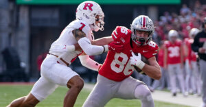 Ohio State Buckeyes tight end Max Klare (86) tries to run past Rutgers Scarlet Knights defensive back Cam Miller (7) during the NCAA football game at Ohio Stadium in Columbus on Nov. 22, 2025. Ohio State won 42-9.