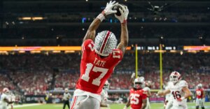 Ohio State Buckeyes wide receiver Carnell Tate (17) makes a catch for a touchdown Saturday, Dec. 6, 2025, during the Big Ten football championship against the Indiana Hoosiers at Lucas Oil Stadium in Indianapolis.