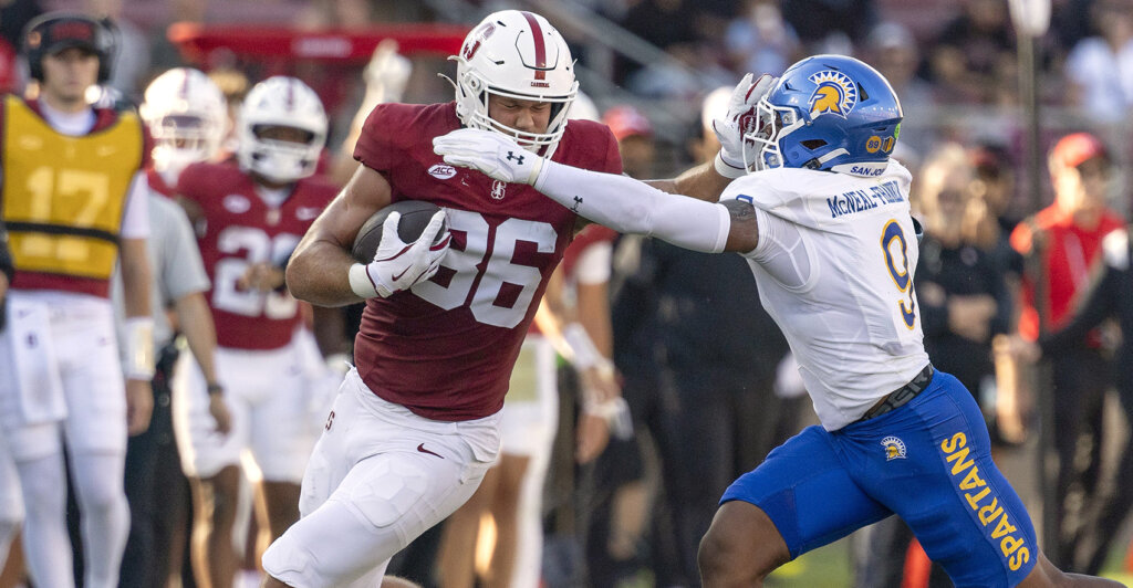 Sep 27, 2025; Stanford, California, USA; Stanford Cardinal tight end Sam Roush (86) stiff arms San Jose State Spartans linebacker Noah McNeal-Franklin (9) during the first quarter at Stanford Stadium. Mandatory Credit: Stan Szeto-Imagn Images