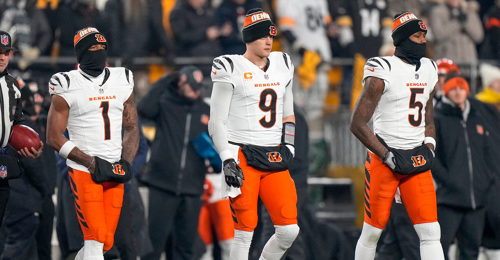 Jan 4, 2025; Pittsburgh, Pennsylvania, USA; Cincinnati Bengals wide receiver Ja'Marr Chase (1), quarterback Joe Burrow (9) and wide receiver Tee Higgins (5) take the field as captains for the coin toss before a game against the Pittsburgh Steelers at Acrisure Stadium. Mandatory Credit: Sam Greene/USA TODAY Network via Imagn Images