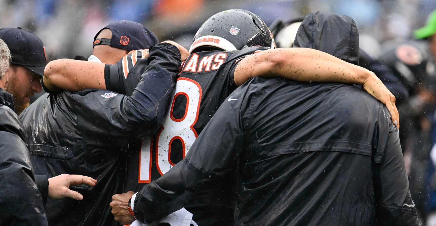 Chicago Bears quarterback Caleb Williams (18) is helped off the field with an apparent injury against the Minnesota Vikings during the second half at Soldier Field.