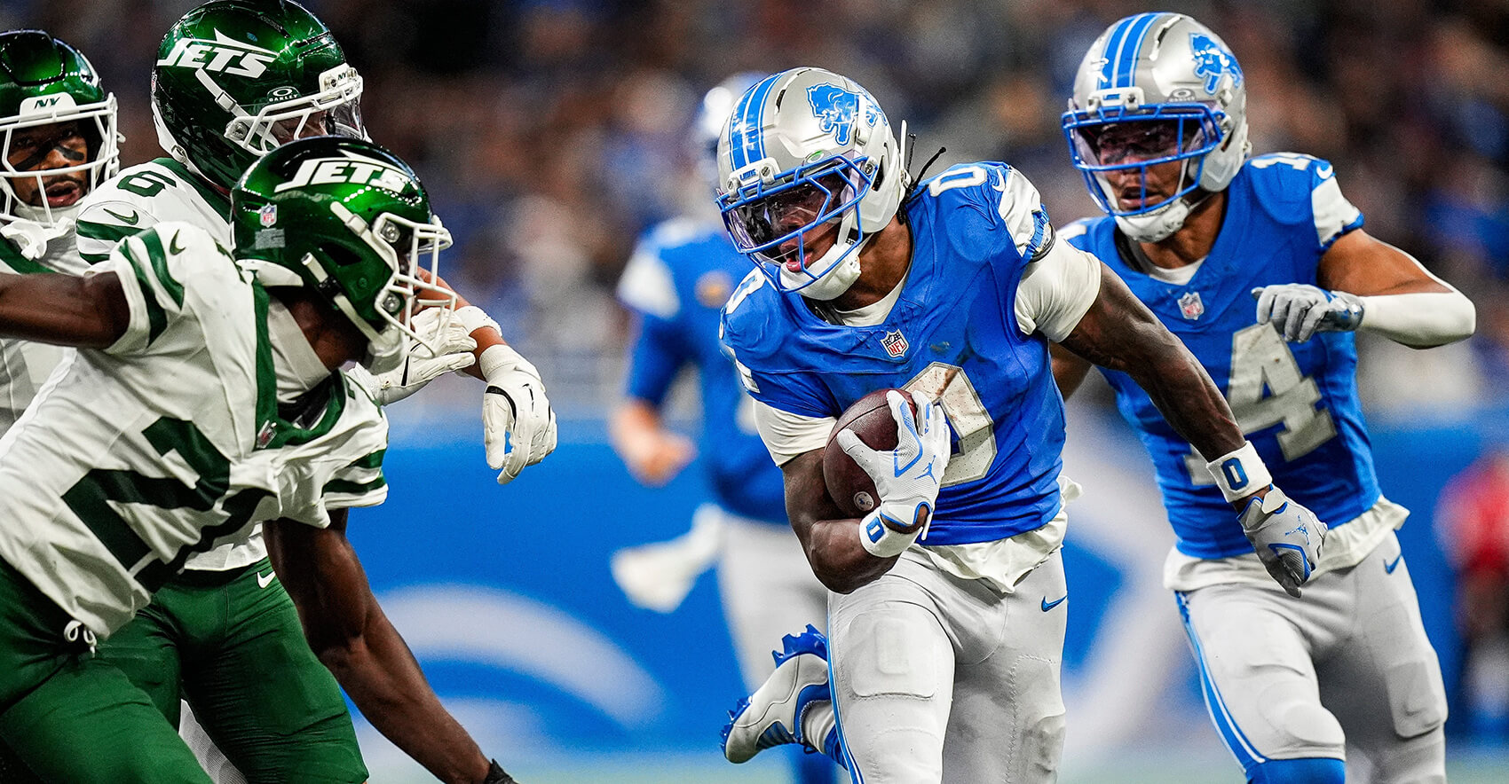 Detroit Lions running back Jahmyr Gibbs (0) runs against New York Jets cornerback Brandon Stephens (21) during the second half at Ford Field in Detroit on Sunday, Sept. 27, 2026.