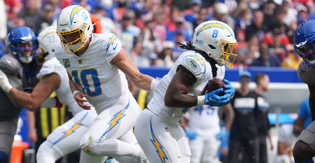 Sep 27, 2026; Orchard Park, New York, USA; Los Angeles Chargers quarterback Justin Herbert (10) hands off to running back Omarion Hampton (8) in the second half against the Buffalo Bills at New Highmark Stadium. Mandatory Credit: Gregory Fisher-Imagn Images