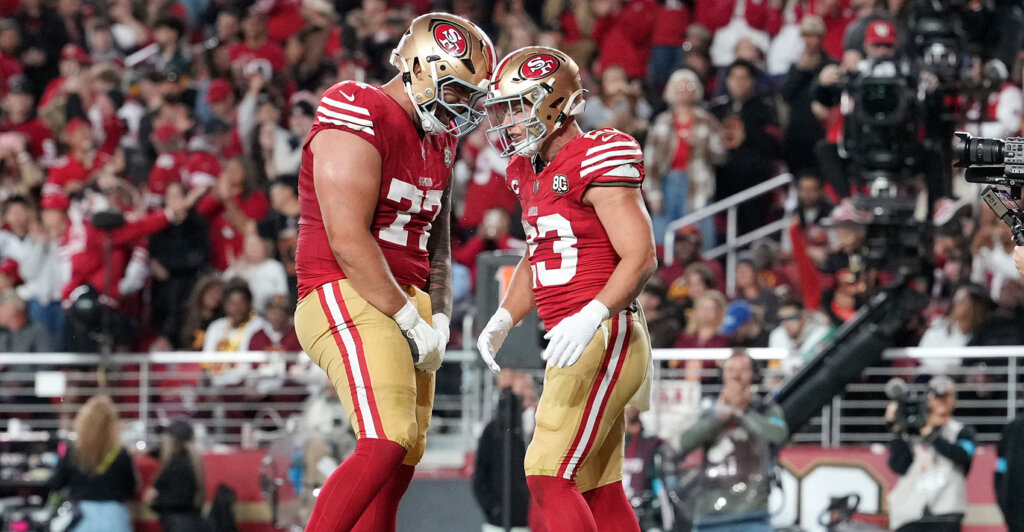 Oct 19, 2026; Santa Clara, California, USA; San Francisco 49ers running back Christian McCaffrey (23) celebrates with San Francisco 49ers offensive line Dominick Puni (77) after scoring a touchdown during the second quarter against the Washington Commanders at Levi's Stadium. Mandatory Credit: Cary Edmondson-Imagn Images