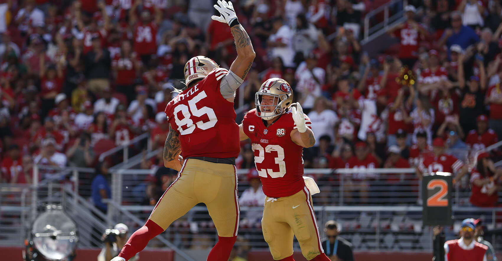Sep 27, 2026; Santa Clara, California, USA; San Francisco 49ers running back Christian McCaffrey (23) reacts with tight end George Kittle (85) after scroing a touchdown against the Arizona Cardinals in the second half at Levi's Stadium. Mandatory Credit: Sergio Estrada-Imagn Images