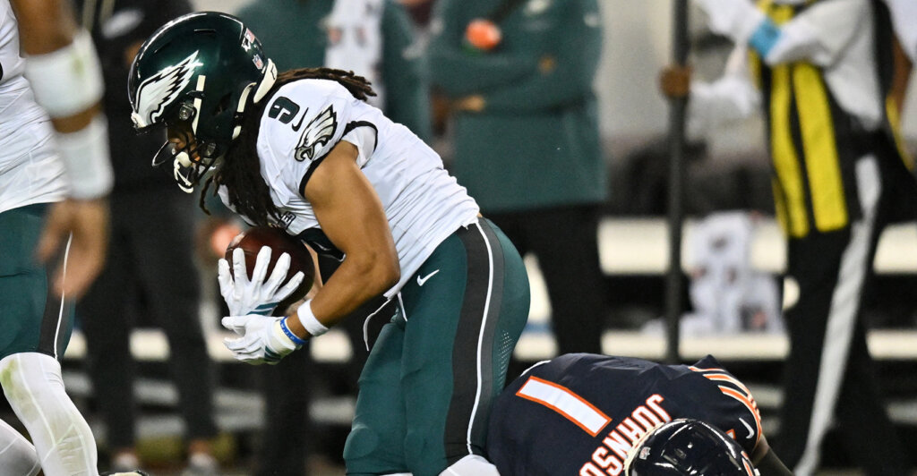 Sep 28, 2026; Chicago, Illinois, USA; Chicago Bears defensive back Jaylon Johnson (1) tackles Philadelphia Eagles wide receiver Makai Lemon (9) during the second half at Soldier Field. Mandatory Credit: Patrick Gorski-Imagn Images